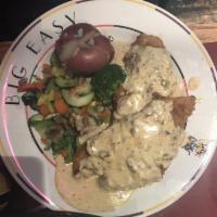 Stuffed Catfish · 2 flour battered catfish fillets piled on top of our seafood stuffing and topped with a chee...