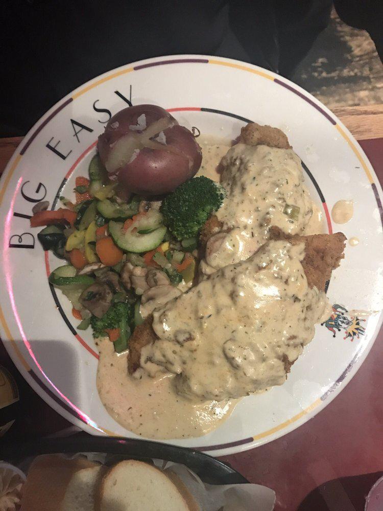 Stuffed Catfish · 2 flour battered catfish fillets piled on top of our seafood stuffing and topped with a cheesy Alfredo sauce. Served with new potatoes and your choice of veggie.