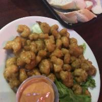 Popcorn Shrimp · Tender shrimp tossed in our Cajun seasoned batter, fried ’til golden and served with Hazel d...