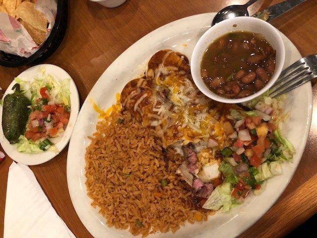 Fajitas Enchiladas · Choice of fajita beef or chicken, rolled into 2 flour tortillas and topped with choice of chile corn carne, queso or sour cream sauce. Spicy.