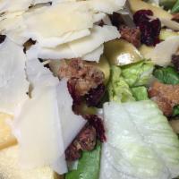 Apple Walnut Salad · Crisp apples, glazed walnuts, dried cranberries and shaved parmesan cheese on a bed of mixed...
