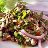 Beef Larb · Beef, mint, cilantro, red or green onions, rice powder and lettuce. 