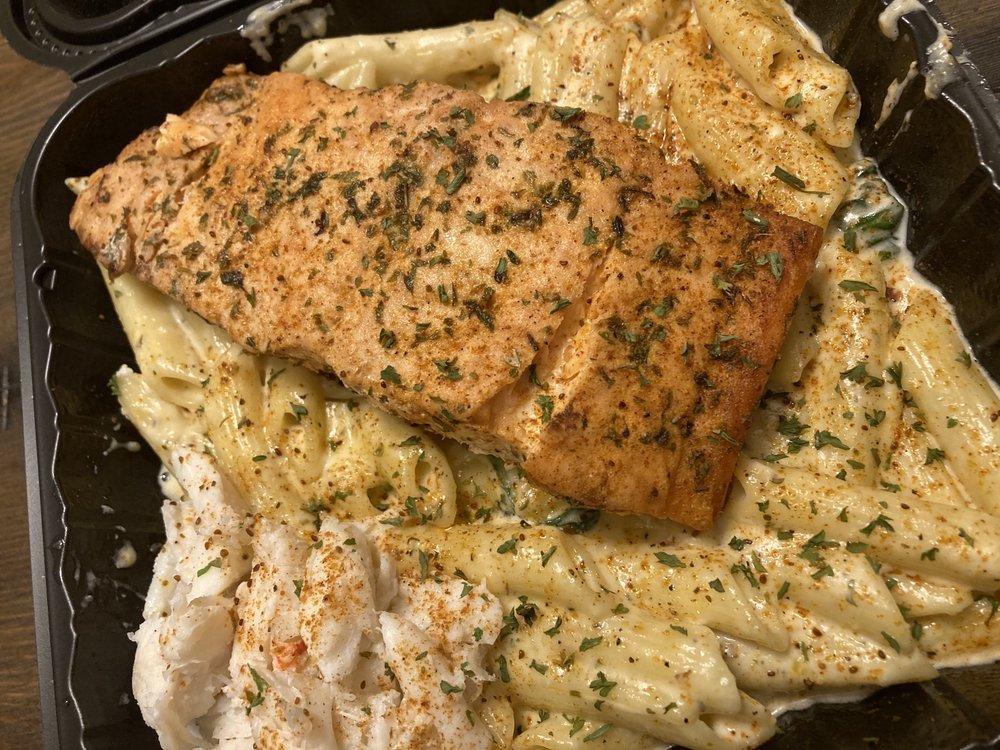 Salmon and Crab Pasta · Grilled salmon and crab creamy Alfredo pasta, sauteed spinach, and penne pasta noodles.