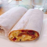 House Egg Wrap · Three scrambled eggs with portobello mushrooms, bacon and Jarlsberg cheese wrapped in a whol...