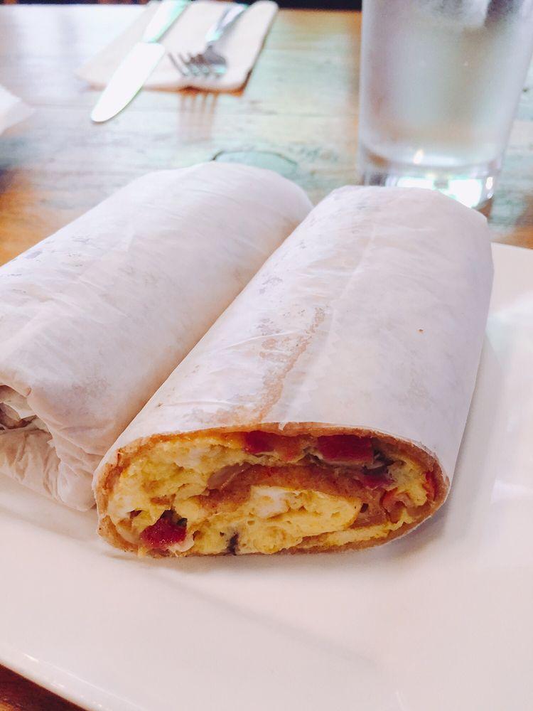 House Egg Wrap · Three scrambled eggs with portobello mushrooms, bacon and Jarlsberg cheese wrapped in a whole wheat tortilla. 