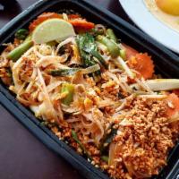 Pad Thai · Rice noodle in house pad Thai sauce with bean sprouts and green onions topped with crushed p...