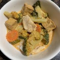 Panang Curry · Carrots, broccoli, kaffir lime leaves and Thai basil.