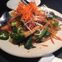 Spicy Crazy Noodles · Stir fried flat rice noodles with chicken, shrimp, vegetables, hot pepper and basil leaves. ...