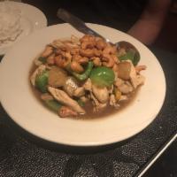 Cashew Chicken · Stir fried chicken with cashew nuts, bell pepper, mushrooms, peapod and pineapples.