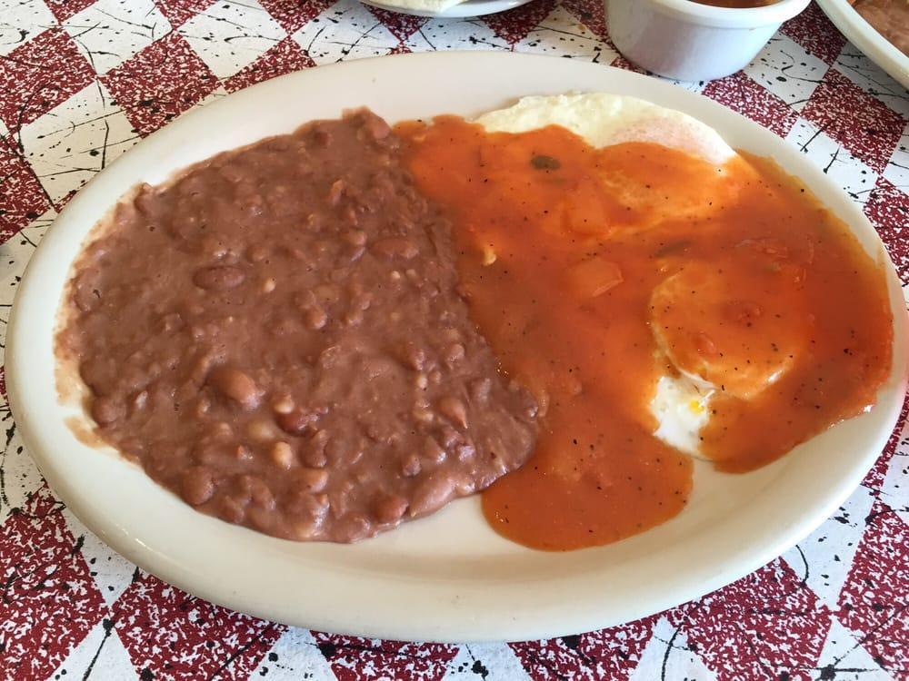 Huevos Rancheros · Fried or scrambled eggs with Tecate sauce on top.