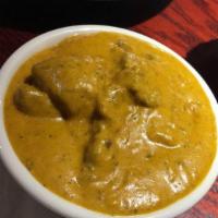 Lamb Korma · Cooked with fresh Indian spices, nut and creamy sauce. Served with rice.