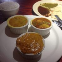 Chicken Korma · Cooked with fresh Indian spices and nuts in a creamy sauce. Served with rice.