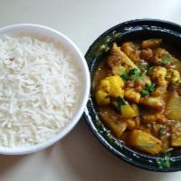 Nepali Aalu Gobi · White cauliflower and fingerling potatoes cooked with blend of spices and tomato garnished w...