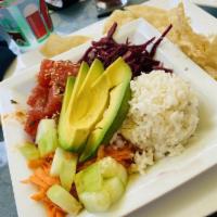 Poke Bowl · Ahi poke, avocado, pickled cabbage, carrots, wonton chips, and poke sauce served with quinoa