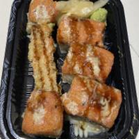 Yummy Roll · Shrimp tempura, avocado, topped with spicy tuna, served with  eel sauce and honey wasabi. raw