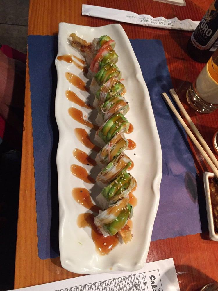 Green Dragon Roll · Sushi roll topped with avocado.