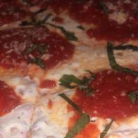 Margherita Pizza · 8 slices. Tomatoes, fresh basil, fresh mozzarella and extra virgin olive oil.