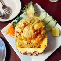 Pineapple Fried Rice · Steamed Jasmine rice sauteed yellow curry powder with egg, shrimps, pineapple, cashew nuts, ...