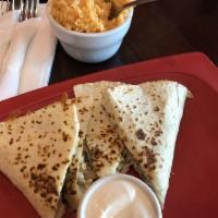 Quesadilla · Flour tortilla filled with cheese and choice of meat.