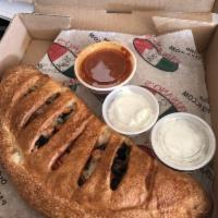 Stromboli · Pepperoni, sausage, onion, green pepper and mozzarella. Served with a side of marinara sauce.