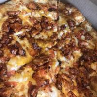 BBQ Chicken Pizza · Grilled BBQ chicken, tomato, onion, cheddar and mozzarella cheese.