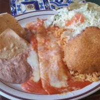 Kid's Mexican Combination Plate · One ground beef taco, 1 cheese enchilada, refried beans, Spanish rice, and a sopapilla.