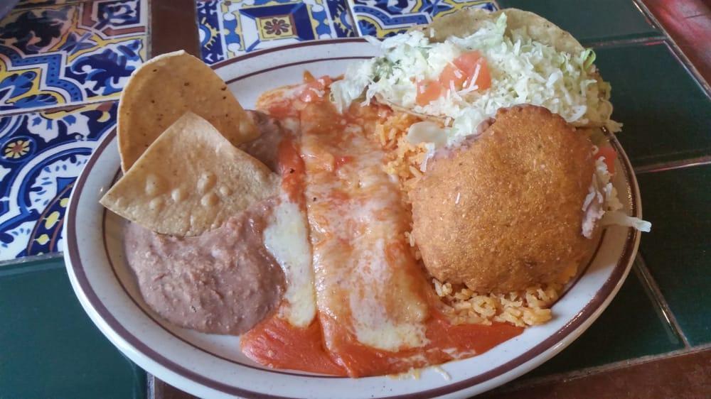 Kid's Mexican Combination Plate · One ground beef taco, 1 cheese enchilada, refried beans, Spanish rice, and a sopapilla.