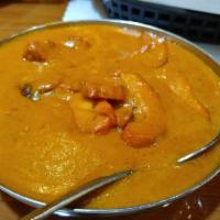 Chicken Makhani - Butter Chicken · Tandoori boneless chicken thigh chops cooked with fresh tomatoes, ginger, garlic, cream, and...