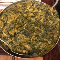 Lamb Saag · Lamb chops cooked with fresh tomatoes, spinach, onions, ginger, garlic, red and green pepper...