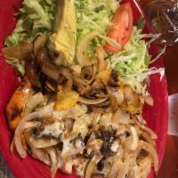Pollo Fiesta · Grilled chicken breast with zucchini, squash, mushrooms, onions, and tomatoes covered with o...