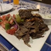 Mix Grill · 1 piece Kefte, 2 pieces of chicken shish, 1 piece lamb chop and gyro meat. Served with rice ...