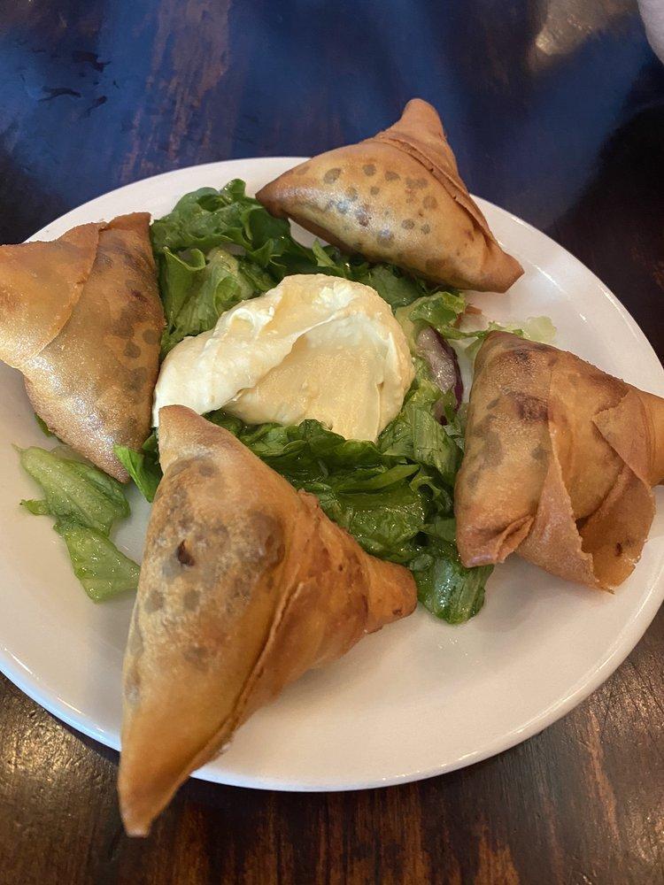 Vegetarian Sambussa · Fried pastry stuffed with lentils, jalapenos, and onions.