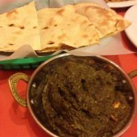 Saag Paneer · Fresh spinach with cottage cheese cooked with blend of spices.