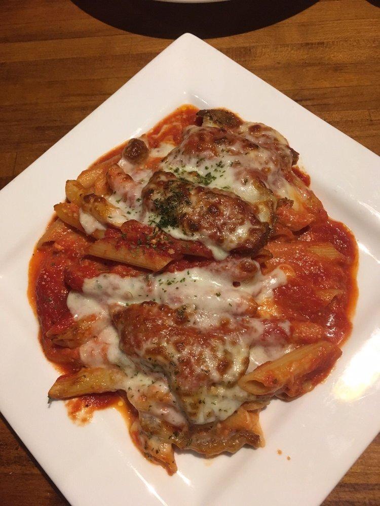 Baked Ziti · A delicious blend of imported penne pasta, pecorino romano, ricotta and our homemade tomato sauce topped with mozzarella cheese and baked to perfection.