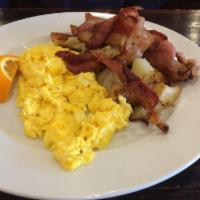 Iron Town Combo · 2 eggs any style with choice of 2 slices of French toast or 2 pancakes, and your choice of b...