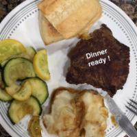 Sirloin Steak · A USDA choice cut, 8 oz. seasoned sirloin steak. Served with two sides and dinner bread.