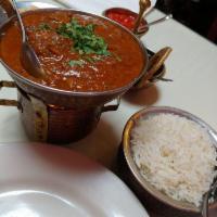 Lamb Vindaloo · Very tender pieces of lamb marinated in fresh tomatoes and lemon, then cooked with potatoes,...
