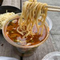 Hand Shaved Noodle with Sliced Beef in Beef Soup · 