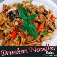 Drunken Noodles · Pan fried noodles with choice of meat, hot basil, bell pepper, mushrooms and garlic in spicy...