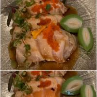 Salmon Dream · Seared sliced salmon with yuzu wasabi sauce. Topped with tobiko & scallion.
