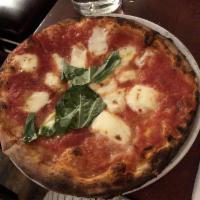 Margherita Pizza · Mozzarella, tomato sauce, basil. Vegetarian.