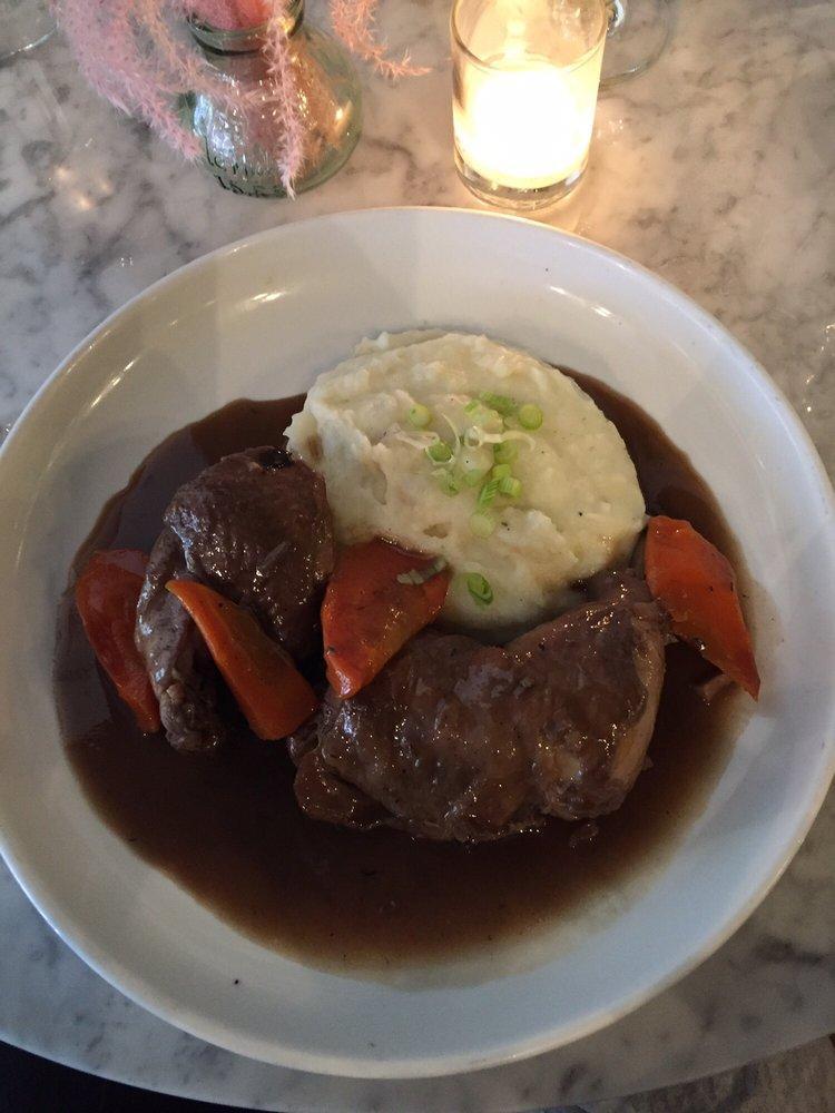 Coq Au Vin · Braised chicken, Carrots, Mushrooms, Red wine demi-glace, Mashed potatoes