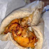 Chicken Kebab Sandwich · Charbroiled strips of chicken breast marinated in a tasty garlic lemon saffron sauce and rol...