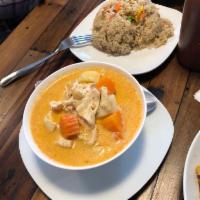 Massaman Curry · Chicken or tofu Simmered in coconut milk and massaman curry with peanuts, potatoes, carrots ...