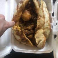 Oxtail Roti · Comes with 2 sides and roti on the side.