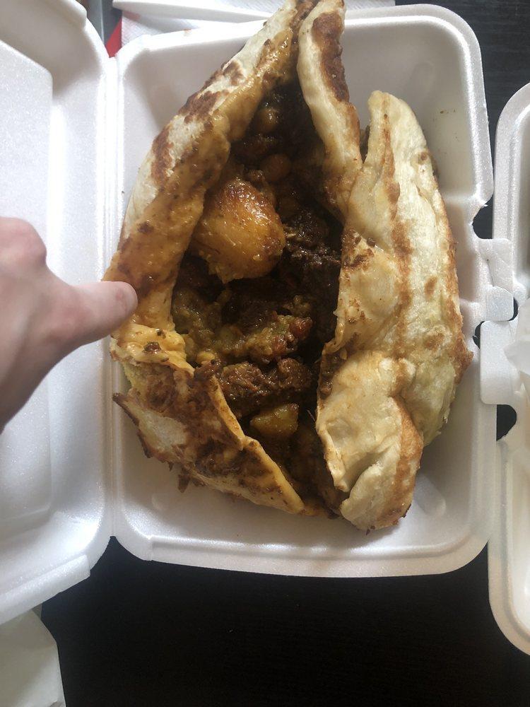Oxtail Roti · Comes with 2 sides and roti on the side.