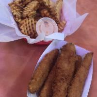 Trolley Chips · Cross-cut masa battered waffle fries tossed in your choice of cajun dust or garlic parmesan....