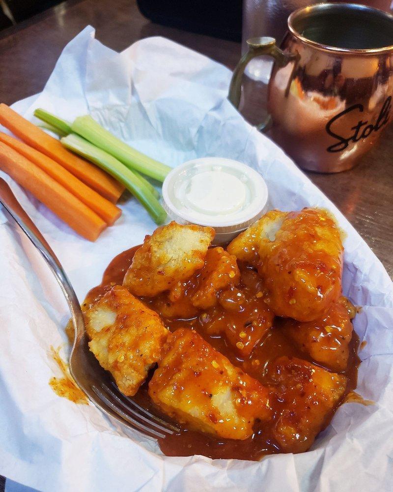 Boneless Wings · Breaded chicken breast baked chopped tossed and sauced. Served with carrots, celery, and choice of dipping sauce.