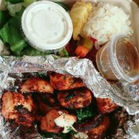 Chicken Kebab Plate · Charcoal-grilled marinated chicken breast cubes. Served with salad, rice, and pita bread.