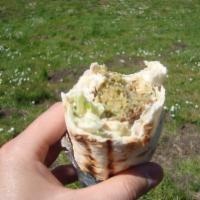 Falafel Wrap · Golden-brown crispy garbanzo balls and hummus. Served in lavash bread with iceberg lettuce, ...